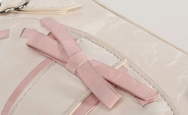 Close-up of the Ribbon Romance Shoulder Bag, highlighting the statement ribbon bow and interwoven ribbon detailing.