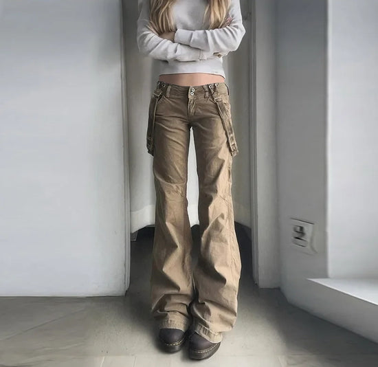 Model wearing Rogue Revival Utility Pants with a light gray sweatshirt and chunky brown shoes