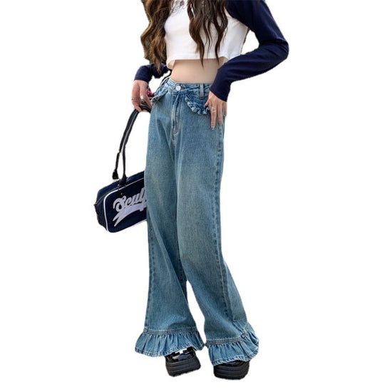 Angled view of Ruffle Flare Wide Leg Jeans showing ruffle detailing at the hem and ruffle faux front pockets