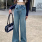 Model standing Ruffle Flare Wide Leg Jeans, showing ruffle hems and high-waisted fit