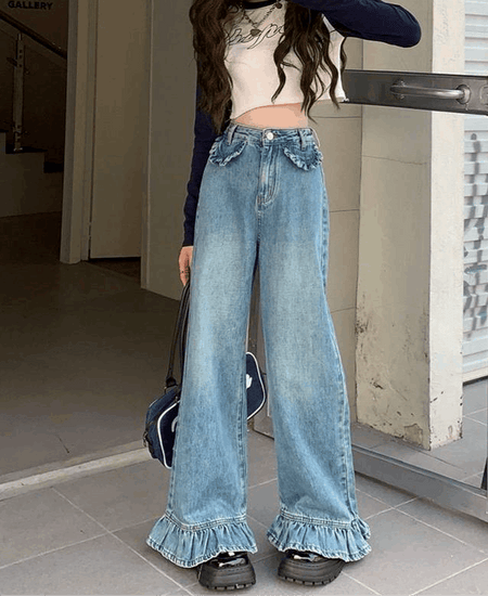 Full outfit view of model wearing Ruffle Flare Wide Leg Jeans