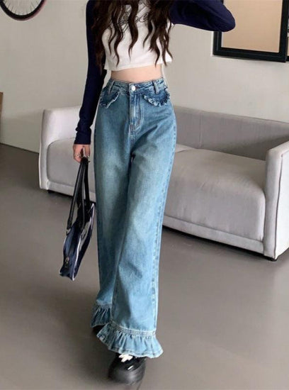 Model walking in Ruffle Flare Jeans showing movement of ruffle hems