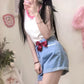 Front-facing look with the red bow styled for a soft girl vibe in the Scarlet Sweetheart High-Rise Shorts.