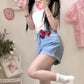 Playful pose of model shows the comfy fit and sweet aesthetic of the Scarlet Sweetheart High-Rise Shorts