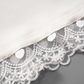 Close-up of the hem and lace detail on the Serene Butterfly Crop Top