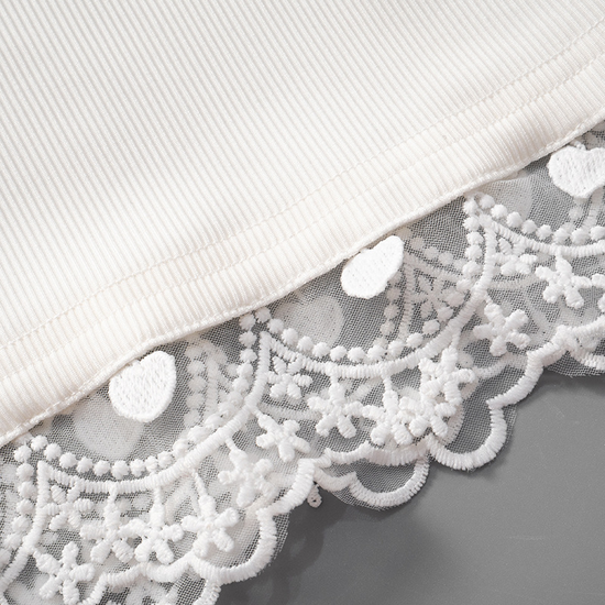 Close-up of the hem and lace detail on the Serene Butterfly Crop Top
