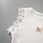 Lace shoulder detail with heart and flower accents on the Serene Butterfly Crop Top