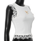 Angled view of Serene Butterfly Crop Top, showing fit and lace shoulder detail