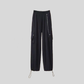 Black utility pants from the Shadow Chain Utility Set featuring a detachable chain accent, elastic waistband, cargo pockets, and adjustable drawstring hems.