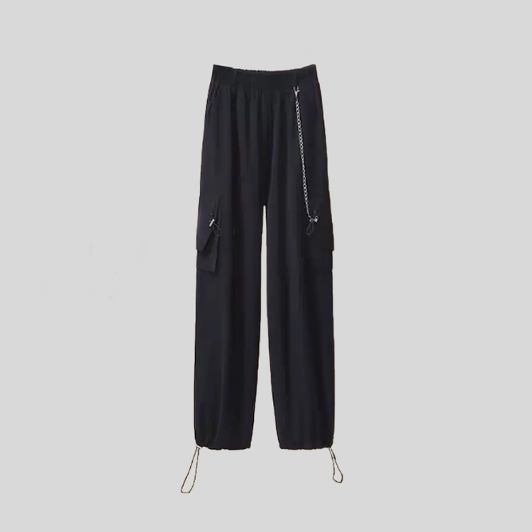 Black utility pants from the Shadow Chain Utility Set featuring a detachable chain accent, elastic waistband, cargo pockets, and adjustable drawstring hems.