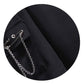 Close-up of the removable safety pin with chain attached to the cropped button-up shirt from the Shadow Chain Utility Set.