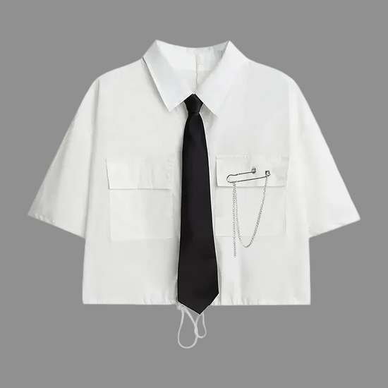White short-sleeve cropped button-up shirt from the Shadow Chain Utility Set featuring a matching black tie, removable safety pin with chain, and adjustable drawstring waist.