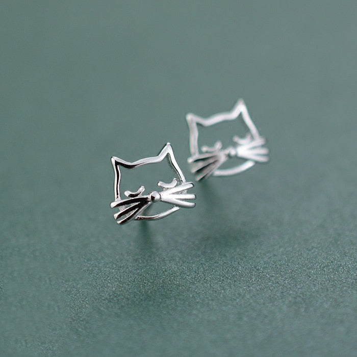 Silver Kitty Stud Earrings shown at an angle with open cat faces and dimensional whisker details.