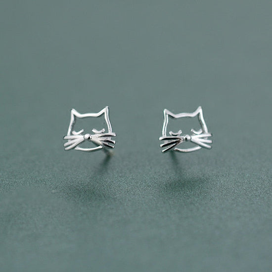 Close-up of the Silver Kitty Stud Earrings showing their open cat faces and dimensional whiskers.
