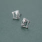 Side-angle view of the Silver Kitty Stud Earrings, highlighting the open-outline cat design.