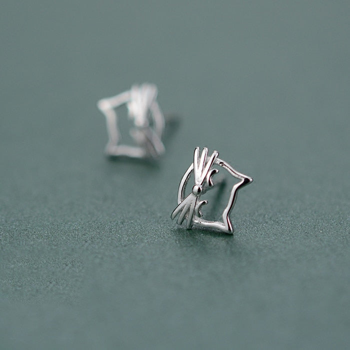 Side-angle view of the Silver Kitty Stud Earrings, highlighting the open-outline cat design.