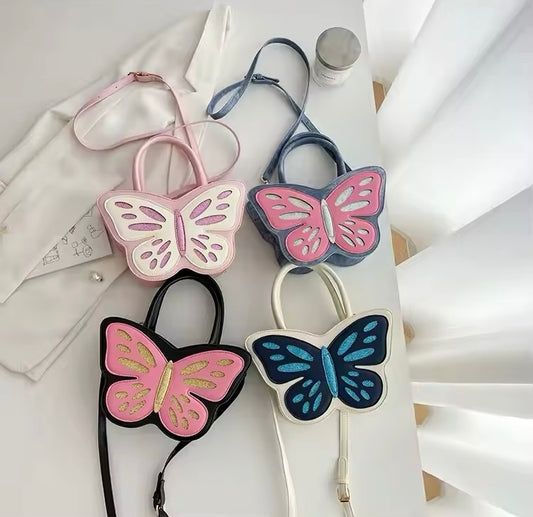 Front view of all four of the Sparkling Butterfly Handbags with glittery butterfly shape and zip closure