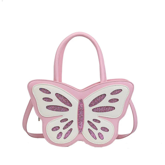 Flat lay of Sparkling Butterfly Handbag in pink and white with glitter finish and top handles