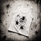 Flat lay of the Spider Vortex Tank Top featuring a bold black spider and swirling vortex graphic on a white sleeveless tank against a spider web-themed background.