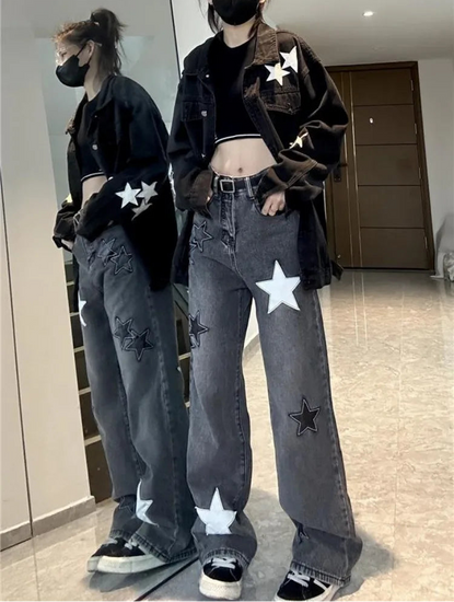 Model wearing the Stargaze Street Jeans in black gray with their reflection showing in a full-length mirror.