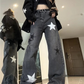 Model wearing the Stargaze Street Jeans in black gray, wide-leg high-rise fit.