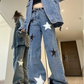 Model wearing the blue colorway of Stargaze Street Jeans, full-length wide-leg fit.