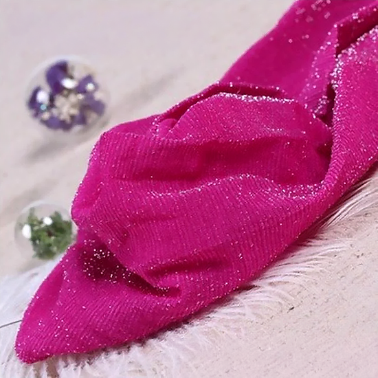 Folded pair of the Starlight Shimmer Tights in rose red with silver shimmer displayed on a white faux-fur surface.