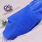 Folded pair of the Starlight Shimmer Tights in royal blue with silver shimmer displayed on a white faux-fur surface.