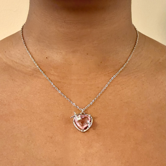 Starlit Love Necklace worn on neck, showing pink heart pendant with silver halo