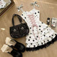 Close-up of the Starry-Eyed Fantasy Dress skirt showing layered white star-print ruffles finished with contrasting black lace trim