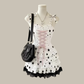 Starry-Eyed Fantasy Dress mini dress with black stars and pink lace-up detail