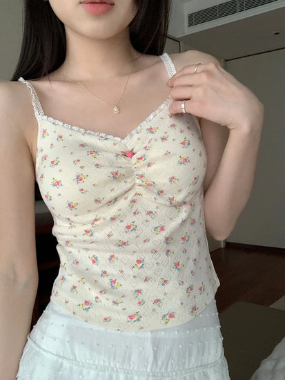 Model wearing cream Sweet Flower Crop Top with multicolor floral print and white skirt.
