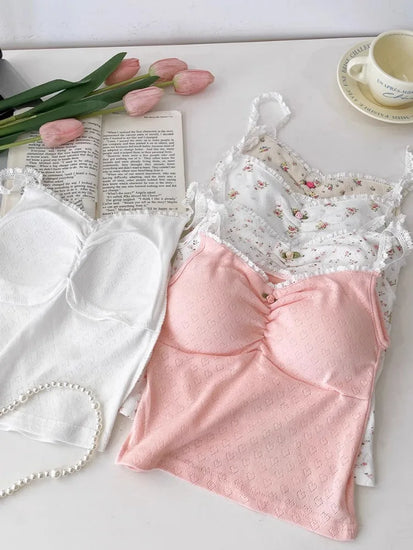 Sweet Flower Crop Tops in floral and heart designs laid out with tulips and a teacup for a soft cottagecore aesthetic.
