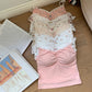 Full range of Sweet Flower Crop Tops in floral and heart prints arranged on a wooden floor.