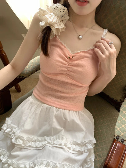 Close-up of pink Sweet Flower Crop Top worn by model, showing lace trim and mini flower detail.