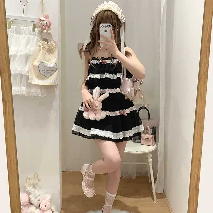 Model wearing the black and pink Sweet Love Lace Bow Skort with a matching coordinating top.