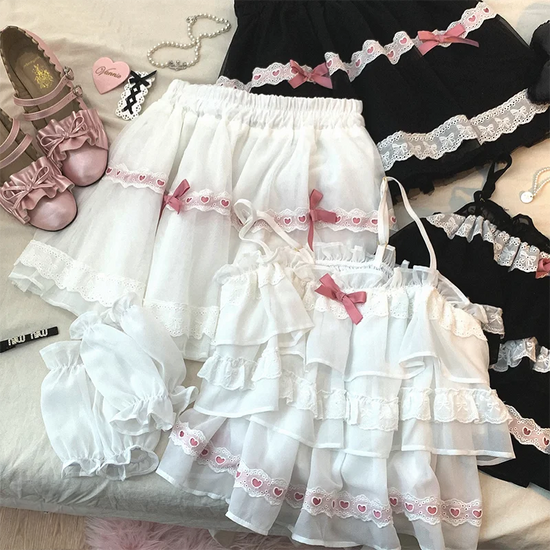 Close-up comparison of the white/pink and black/pink Sweet Love Lace Bow Skort color options with matching tops.