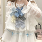 Model wearing the white and blue Sweet Love Lace Bow Skort styled with a top with multiple bows.
