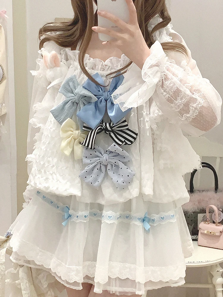 Model wearing the white and blue Sweet Love Lace Bow Skort styled with a top with multiple bows.