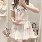 Model styling the white and pink Sweet Love Lace Bow Skort while holding a plush bunny.