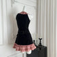 Back mannequin view of the Sweetheart Stitch Denim Dress showing fitted seams and a pink plaid hem.