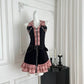 Black and pink plaid Sweetheart Stitch Denim Dress displayed on a mannequin in a white room.