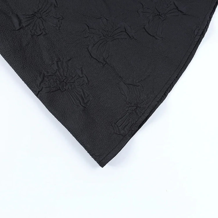 Detail of the embossed butterflies on the skirt of the Thorned Rose Corset Dress.