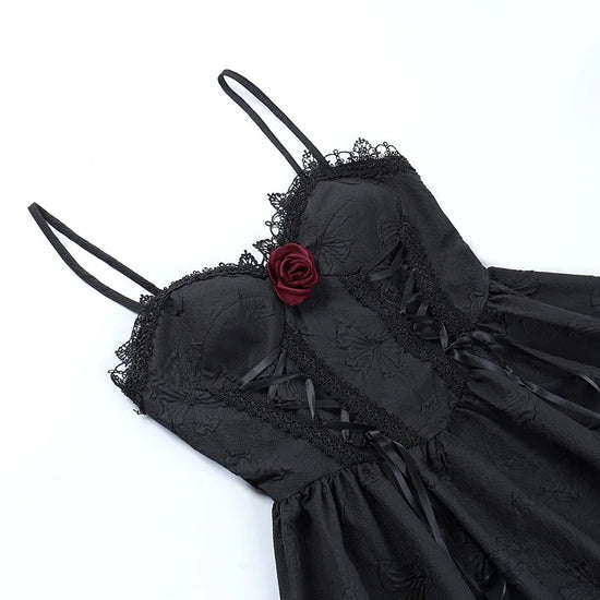 Flat lay close-up of the bodice on the Thorned Rose Corset Dress, showing the rose appliqué and lace trim.