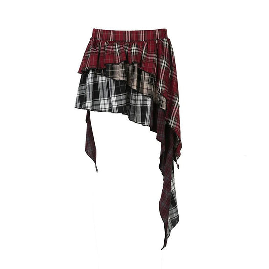 Flat lay of the Tilted Temper Tartan Skirt showcasing mismatched plaid panels and angled hem