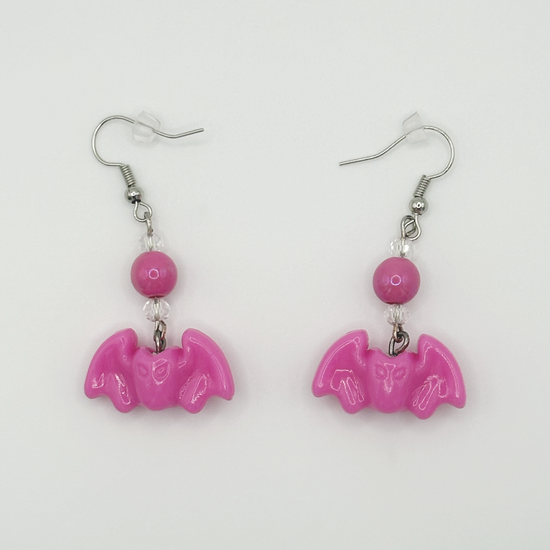 Two Moody Originals Candy Bite Bat Earrings in hot pink with bead detail