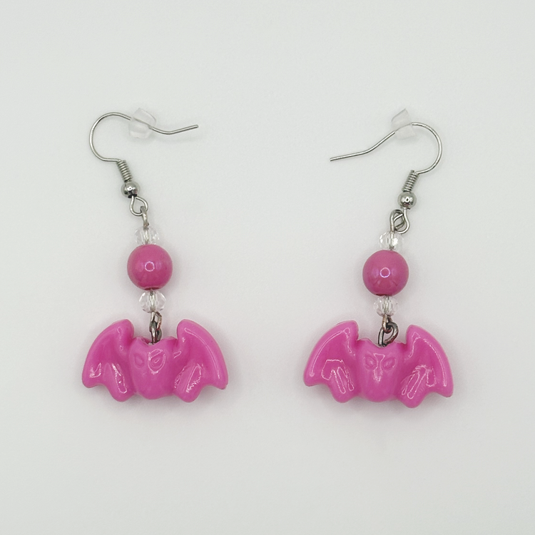 Two Moody Originals Candy Bite Bat Earrings in hot pink with bead detail