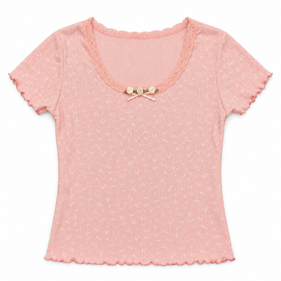Front flat lay of the pink Bright Dreams Two Moody Originals: Floral Daydream Top with floral pointelle texture and cream rose appliqués and a bow.