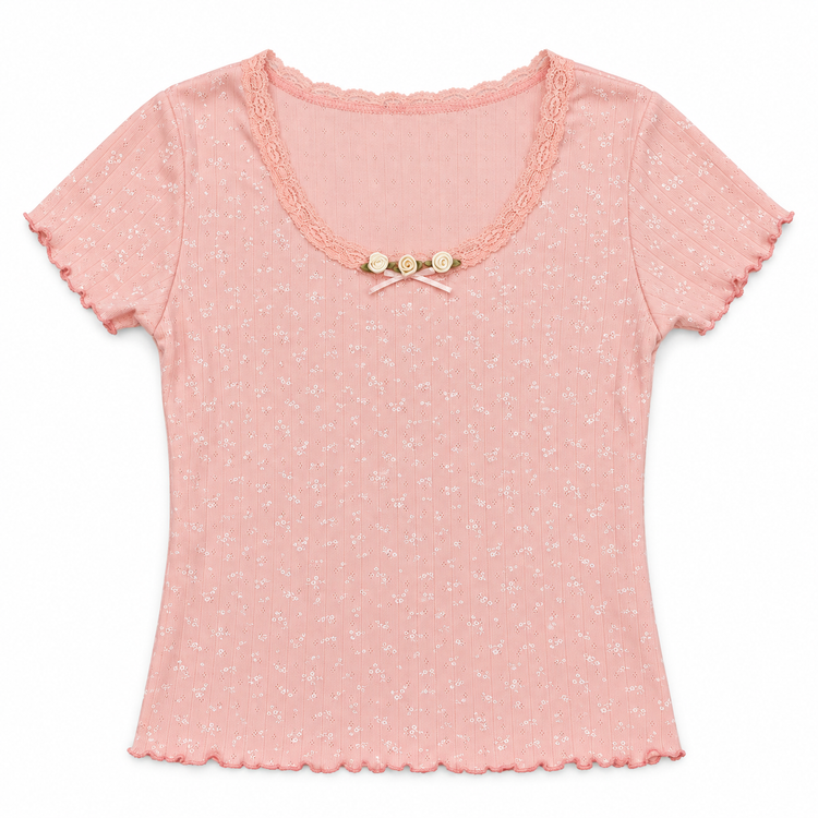Front flat lay of the pink Bright Dreams Two Moody Originals: Floral Daydream Top with floral pointelle texture and cream rose appliqués and a bow.