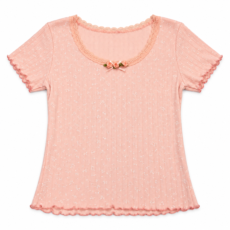 Front flat lay of the coral pink Two Moody Originals: Floral Daydream Top with ribbed pointelle texture and three peach rose appliqués and a bow.